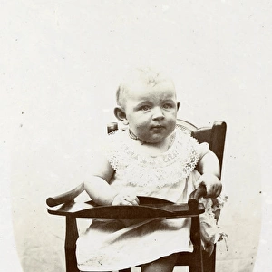 Baby in a high chair, Normandy, France