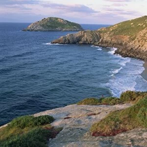 Rocky coastline and inaccessible beach near Punt de