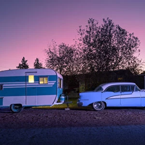 USA, Oregon, Redmond, classic car and trailer at dusk
