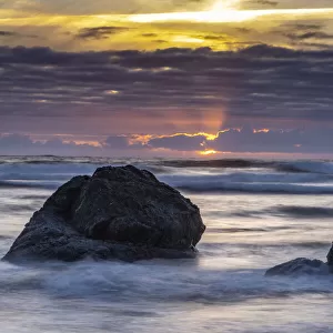 USA, Oregon, Bandon Beach. Pacific Ocean shoreline at sunset