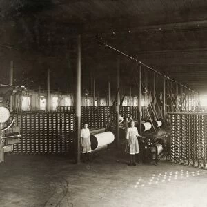 HINE: CHILD LABOR, 1912. Interior view of the large warping room with young workers