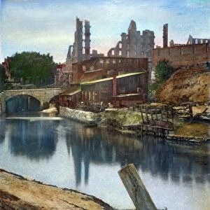 RICHMOND IN RUINS, 1865. Ruins of the Gallego Flour Mills at Richmond, Virginia, destroyed by Confederate troops before the evacuation of the city 2 April 1865: oil over a photograph, 1865