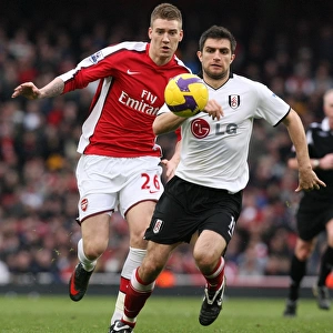 Andrej Arshavin (Arsenal) Aaron Hughes (Fulham)