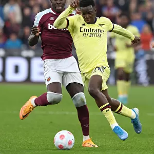 Arsenal's Eddie Nketiah Faces Off Against West Ham's Kurt Zouma in Premier League Clash
