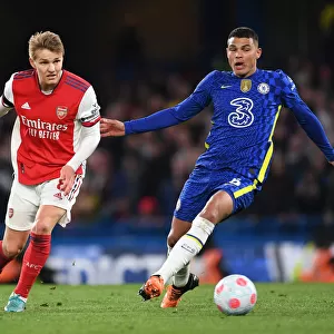 Clash at Stamford Bridge: Arsenal's Martin Odegaard Faces Off Against Chelsea's Thiago Silva (2021-22 Premier League)