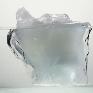 Block of ice in water