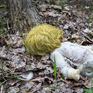 Creepy doll in the forest of Chernobyl exclusion zone