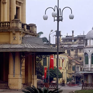 Colonial architecture in Vietnam: Entrance of the Municipal Theatre of Hanoi, built by architect Francois Lagisquet, from 1900 to 1914, inaugurated in 1911, inspired by the Palais Garnier, in the background