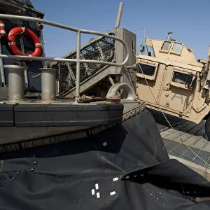 A Humvee debarks a landing craft air cushion