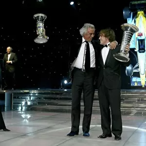 2005 FIA Awards Monaco, 9th December. Flavio Briatore and Fernando Alonso celebrate on stage. World Copyright: Malcolm Griffiths/LAT Photographic ref: Digital Image Only