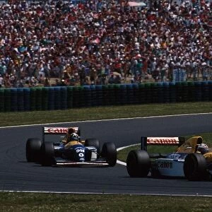 Formula One World Championship: Race winner Alain Prost Williams FW15C leads team mate Damon Hill to a dominant Williams 1-2 finish