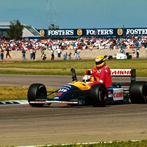 Formula One World Championship: Race winner Nigel Mansell Williams FW14 carries back to the pits fourth place finisher Ayrton Senna McLaren