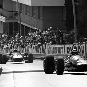 Monte Carlo, Monaco. 7 May 1967: Graham Hill, Lotus 33-BRM, 2nd position, leads Chris Amon, Ferrari 312, 3rd position, action