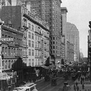 Historic image in black and white of busy Randolph Street in Chicago; Chicago, Illinois, United States of America