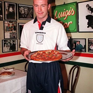12 - ALAN SHEARER SHOWING OFF THE NEW 1997 ENGLAND KIT HOLDING A PIZZA