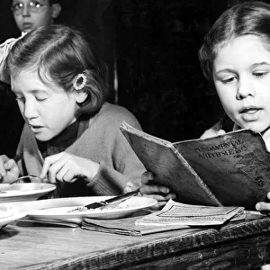 Over 37000 children in Londons L. C. C. scholos today sat down with pen