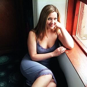 Anne Mitchell Actress June 1999 Sitting at window Low cut blue dress