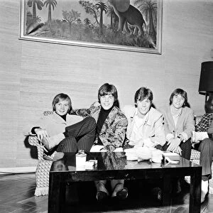 The Bee Gees seen here watching television in their hotel room 17th October 1967