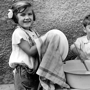 Two children washing up. c. 1945 P044496