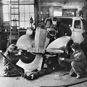 Female mechanics, connected to the ARP (Air Raid Precaution unit) seen fixing a car