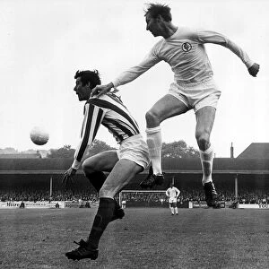 Jack Charlton of Leeds United jumps up to beat John Ritchie during their league match