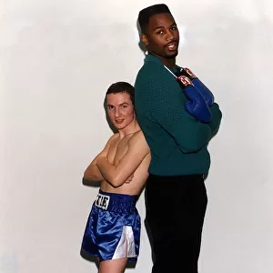Lennox Lewis Heavyweight Boxer stands well over Mickey Cantwell