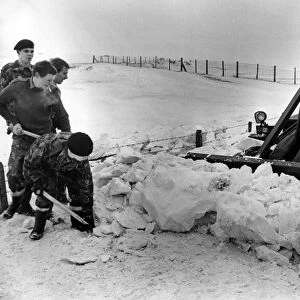 Members of the 1st Battalion, Royal Regiment of Wales clearing snow at Ogmore-by-Sea