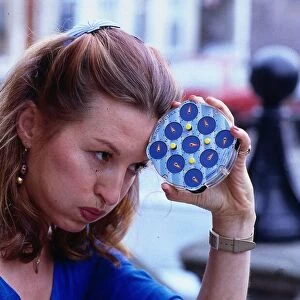 Vivien Heilbron actress August 1988 Holding Rubick clock to head