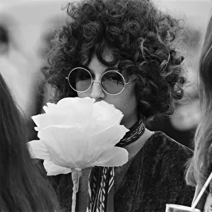 A young couple of females, with large flower and fashionable sunglasses at The Windsor