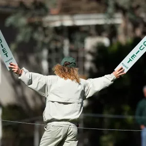 Golf Marshal Holds Quiet Signs Golf Marshal Holds Quiet Signs