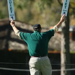 Golf Marshal Holds Quite Signs Golf Marshal Holds Quite Signs