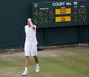 Walks Prints: John Isner Walks Past Scoreboard