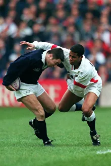 Guscott Prints: Lee Tackled By Guscott