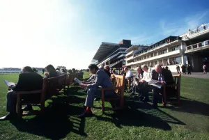 Racegoers On Benches