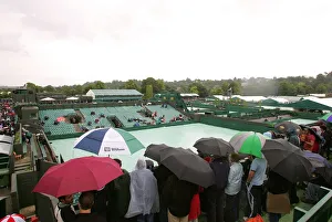 Genral View Prints: Rain Holds Up Play