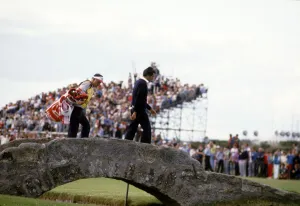 Seve Ballesteros & Caddie Crosses Bridge
