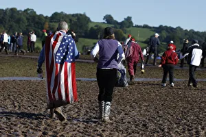 Spectators Walk Through Mud