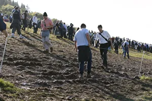 Spectators Walk Through Mud