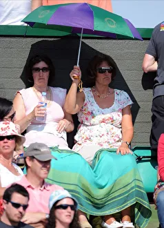 Art Or Moody Prints: Tennis Fans Under Umbrella