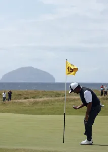 Levet Prints: Thomas Levet Picks Out His Ball After Hole In One On 15th