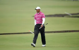 Tiger Woods Walks Onto The 1st Green