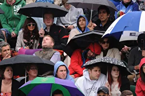 Umbrellas Out As Rain Delays Play