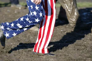 Wade Prints: Usa Spectators Wade Through Mud